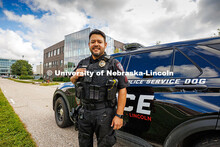 Anderson Delgado, a Police Sergeant and Explosive Detective Canine Handler for UNLPD, poses in front