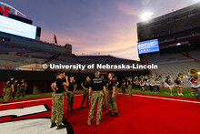 NROTC members chat after running 2,071 stairs for the 9/11 stair climb in Memorial Stadium in commem