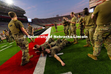 Army ROTC members take photos of Max Holmstrom, Colten Stevens and Luke Rathjen after the three frie