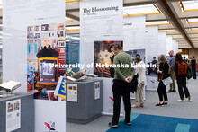 Visitors view “The Muck, the Seeds, the Weeds, the Blossoming: The Journals of Karen Blessen,” a