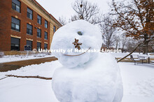 One-eyed snowman near Andrews Hall. Snow on city campus. January 9, 2024. 