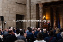 Audience members clap during the State of the University address in the Rotunda of the Nebraska Stat