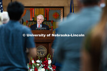 Jeffrey Gold, President of the University of Nebraska System, gives a slight smile as he receives a 