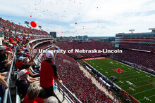 Balloons are released after the Huskers score their first touchdown in the game against the Universi