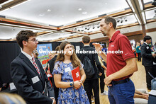 Wyatt Nelson (left to right) and Alanna Snyder, both from the College of Engineering, chat with a re
