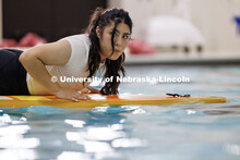 Jaquelin Serrano Rivas, senior Forensic Science major, participates in Paddleboard Yoga at the rec c