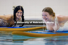 Bella Puetz (left), sophomore Broadcasting and Sports Media and Communication double major, laughs a