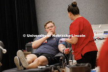 Benjamin Arens, sophomore mechanical engineering major, gives blood during the 2025 Homecoming Blood