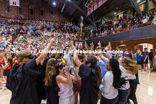 Mortarboard holds up the first-place trophy after winning showtime for their category. Recognized St