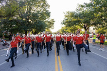 Members of the Cornhusker Marching Band dance as the homecoming parade begins. 2025 Homecoming Parad