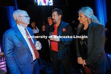 Jeffrey Gold, left, President of the University of Nebraska System, talks with Larry Witzer, center,