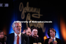 Andy Belser, Dean of the Hixson-Lied College of Fine and Performing Arts, listens to speakers inside