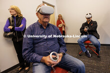 Jeff Sotzing (center-left), and Larry Witzer (right), both members of the Johnny Carson Foundation, 