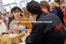 Luka Benjamin (left), senior Acting major, speaks with Larry Witzer, Johnny Carson Foundation member