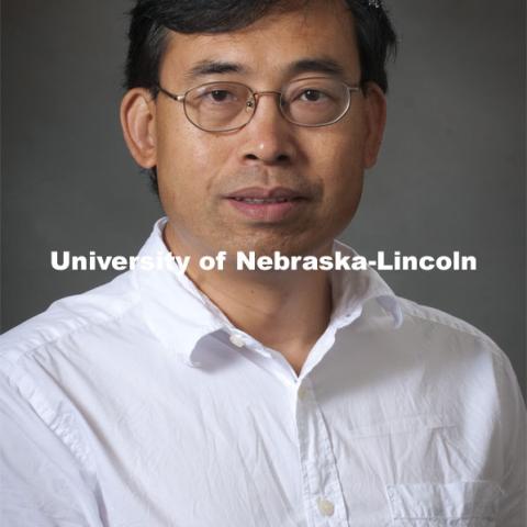 Pictured; Quingsheng Li, Associate Professor, School of Biology. Academic Affairs, New Faculty Orientation, Studio Portrait. 100818, Photo by Greg Nathan, University Communications Photographer.