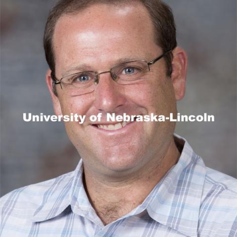 Studio portrait of Mike Lippman, Assistant Professor, Classics and Religious Studies. August 20, 2014. Photo by Craig Chandler, University Communications.