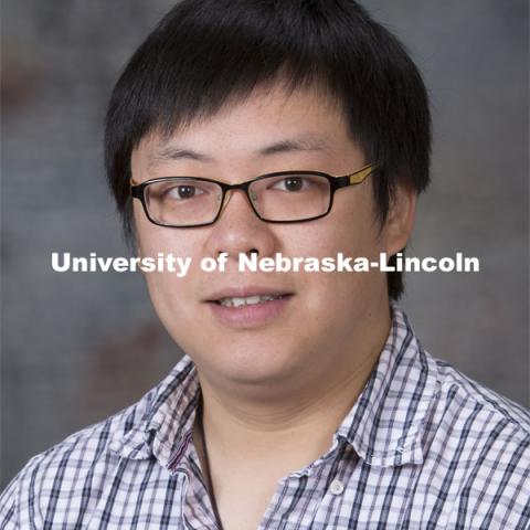 Studio portrait of Yumou Qiu, Assistant Professor, Statistics. August 20, 2014. Photo by Craig Chandler, University Communications.