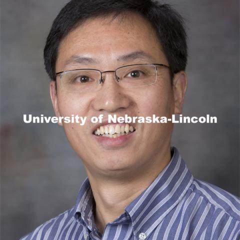 Studio portrait of Li Rong Zeng, Assistant Professor, Plant Pathology,  August 20, 2014. Photo by Craig Chandler, University Communications.