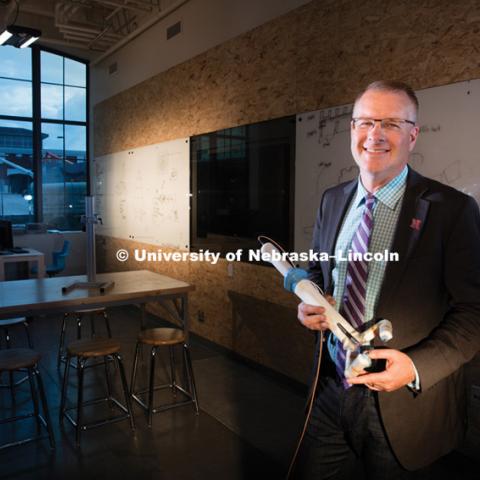 Shane Farritor holds his surgery robot in the prototyping area of Nebraska Innovation Campus' Innovation Studio. September 25, 2015. Photo by Craig Chandler/University Communications