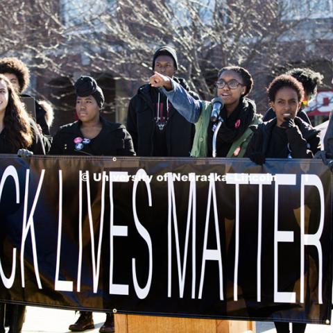 Carnetta Griffin acknowledges the crowd as she leads the rally. Black Lives Matter rally filled the green space north of the Nebraska Union with several thousand students, faculty and staff Thursday. Ten students spoke on their thoughts and experiences. November 19, 2015. Photo by Craig Chandler / University Communications