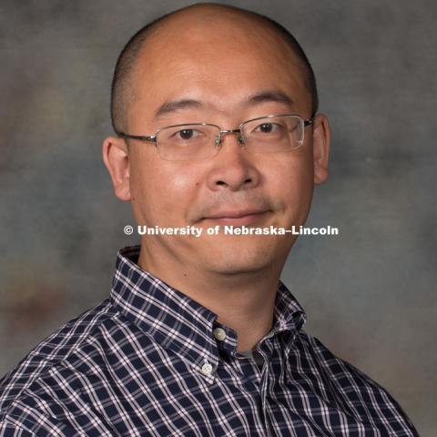 Studio portrait of Zheng Xu, Research Assistant Professor. New Faculty Orientation. August 29, 2016. Photo by Greg Nathan, University Communication Photography.