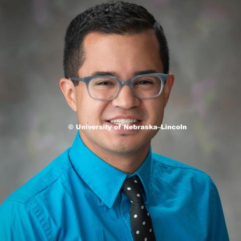 Studio portrait of Justin Gibson, Design Associate for Marketing and Communications, College of Arts and Science. September 28, 2016. Photo by Greg Nathan, University Communication Photography.