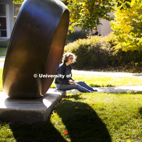 Miranda Russell sits in the shade of Fragment X-O in the Sheldon Memorial Sculpture gardens as she sketches Architecture Hall for her architecture studio second year course. October 24, 2016. Photo by Craig Chandler / University Communication Photography.