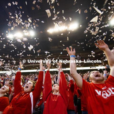 Students  throw newsprint confetti into the air to celebrate the first Husker basket of the game.  The student section ritual is a Husker tradition. Nebraska mens basketball vs. Ohio State at the Pinnacle Bank Arena.  January 18, 2017, Photo by Craig