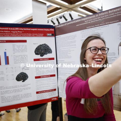 Kayla West takes a selfie to send to her parents to show her and her research poster. The first day of the Spring Research Fair features undergraduate student research. April 4, 2017. Photo by Craig Chandler / University Communication.