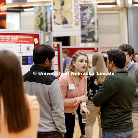 Janelle Adams listens to a question while discussing her research. The first day of the Spring Research Fair features undergraduate student research. April 4, 2017. Photo by Craig Chandler / University Communication.