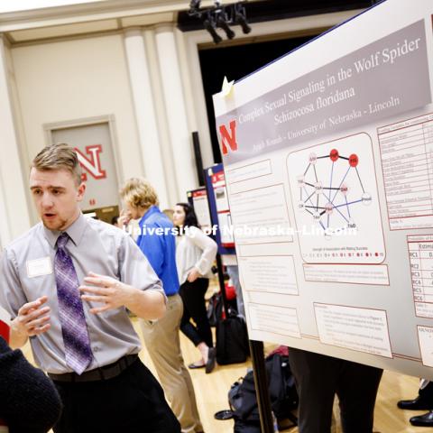 Arich Knaub talks about his mathematical research into the wolf spider. The first day of the Spring Research Fair features undergraduate student research. April 4, 2017. Photo by Craig Chandler / University Communication.