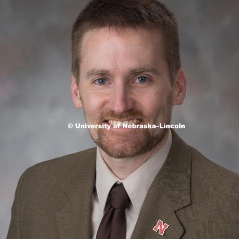 Studio portrait of Neal Bryan, Associate Director of Graduate Student and Postdoc Students, Office of Graduate Studies. April 14, 2017. Photo by Greg Nathan, University Communication Photography.