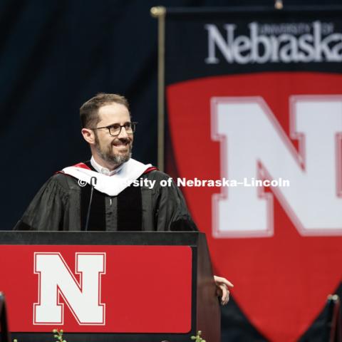 Evan Williams, Nebraska native and founder of Twitter, smiles at his family in the arena while delivering the commencement address. Williams received an honorary degree before he delivered the Commencement Address "Farm Kid Swipes Fire". Students received