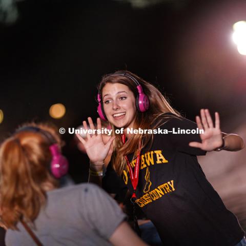 Grace Fawcett dances during the headphone disco party at the Back to School Bash on the Nebraska Union Plaza and Green Space sponsored by Campus NightLife. Students enjoyed a headphone disco party, inflatable games, and refreshments. August 25, 2017.