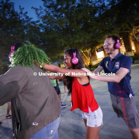 Students dance during the headphone disco party at the Back to School Bash on the Nebraska Union Plaza and Green Space sponsored by Campus NightLife. Students enjoyed a headphone disco party, inflatable games, and refreshments. August 25, 2017. Photo by