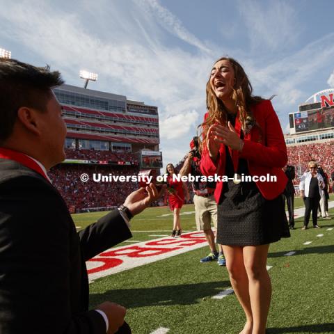 It was a memorable day for University of Nebraska-Lincoln seniors Shayne Arriola and Laura Springer, both of Grand Island. First, they became homecoming king and queen; then they became fiancé and fiancée. After being crowned on the field at Memorial
