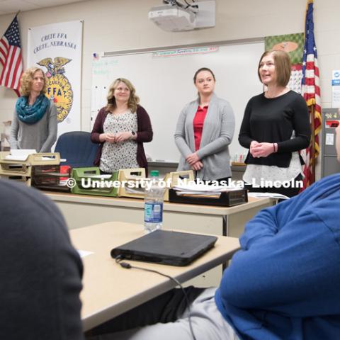 Researchers graduate student Rachel Ibach (purple sweater), Julie Obermeyer (grey sweater), and Jenny Keshwani (black shirt) talk at a Crete High School with students about STEM career fields. March 26, 2018. Photo by Greg Nathan, University Communication.