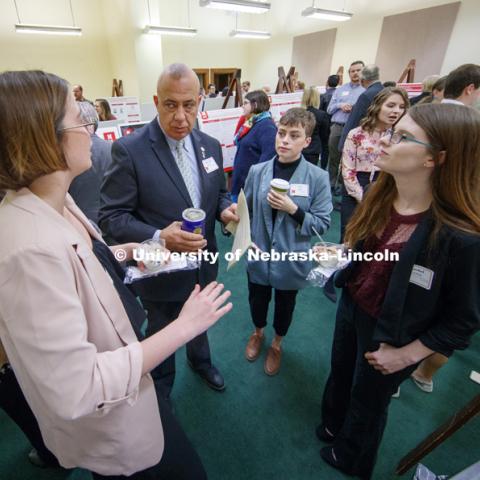 Senator Tom Brewer listens as Bailea Kerr and her teammates explain the George Eliot Review Digitization Project. State Senators Research Fair at the Capitol. April 10, 2018. Photo by Craig Chandler / University Communication.