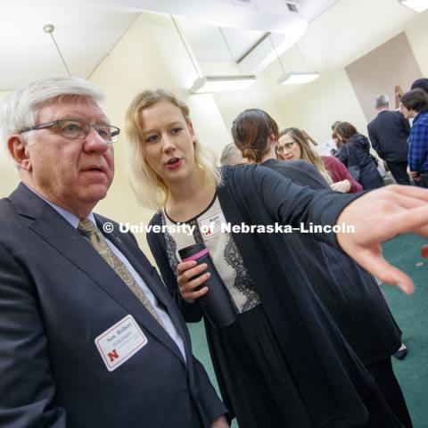 Regan Gilmore explains her research on Statistical Analysis of Agriculture Conservation Practices to Senator Robert Hilkemann. State Senators Research Fair at the Capitol. April 10, 2018. Photo by Craig Chandler / University Communication.