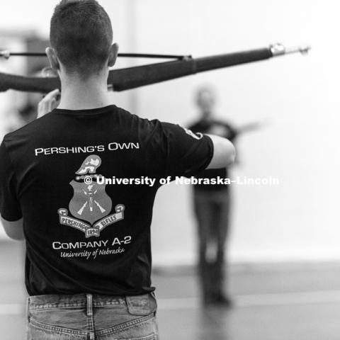 Air Force Cadet 3rd Class Zachary Day leads the group in warm-ups. Pershing Rifle drill team practices in the Pershing Military and Naval Science Building. Student organization sponsored by ROTC. April 17, 2018. Photo by Craig Chandler / University