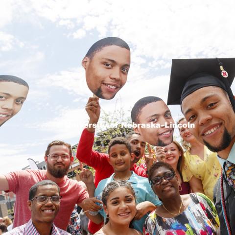 Preston Barrett and his fan club of family and friends pose for a photo outside Pinnacle Bank Arena. Undergraduate Commencement at Pinnacle Bank Arena. May 5, 2018. Photo by Craig Chandler / University Communication.