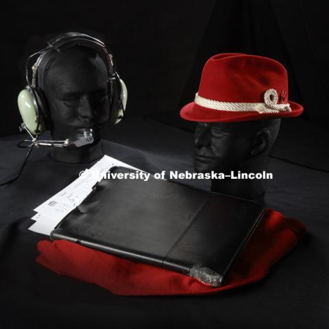 Icons of coaching legends. Pictured; Tom Osborne's headset, Bob Devaney's hat, and John Cook's clipboard. Photographed for the N150 anniversary book. May 24, 2018. Photo by Craig Chandler, University Communication.