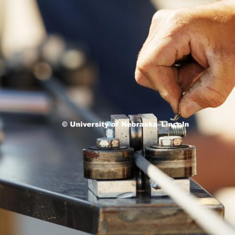 Pins anchor the nuts and bolts holding down the guide for the steering cable. Test of bull-nose barrier for use in medians to protect cars from overpass columns. Test was at university's Midwest Roadside Safety Facility at the Lincoln airport. June 5, 2018. Photo by Craig Chandler / University Communication.