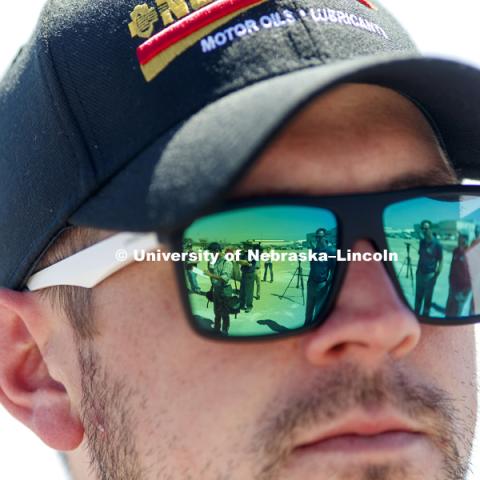 The media is reflected in the sunglasses of NASCAR Xfinity Series driver Michael Annett during the tour. Test of bull-nose barrier for use in medians to protect cars from overpass columns. Test was at university's Midwest Roadside Safety Facility at the Lincoln airport. June 5, 2018. Photo by Craig Chandler / University Communication.