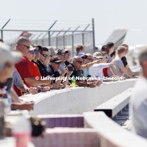 The NASCAR tour group, media and others watch the crash test from behind barriers. Test of bull-nose barrier for use in medians to protect cars from overpass columns. Test was at university's Midwest Roadside Safety Facility at the Lincoln airport. June 5, 2018. Photo by Craig Chandler / University Communication.