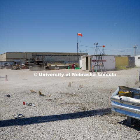 A truck is crashed in to a bull-nose barrier for use in medians to protect cars from overpass columns. The front wood pylons are designed to shear off easily along with several metal ones. The shearing allows the energy of the crash to be transferred into the ground. Cables in the guardrails are designed to keep the car or truck captive and not let it deflect back into traffic. Test was at university's Midwest Roadside Safety Facility at the Lincoln airport. June 5, 2018. Photo by Craig Chandler / University Communication.