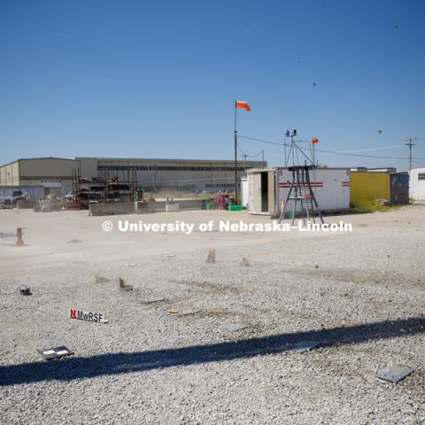 A truck is crashed in to a bull-nose barrier for use in medians to protect cars from overpass columns. The front wood pylons are designed to shear off easily along with several metal ones. The shearing allows the energy of the crash to be transferred into the ground. Cables in the guardrails are designed to keep the car or truck captive and not let it deflect back into traffic. Test was at university's Midwest Roadside Safety Facility at the Lincoln airport. June 5, 2018. Photo by Craig Chandler / University Communication.