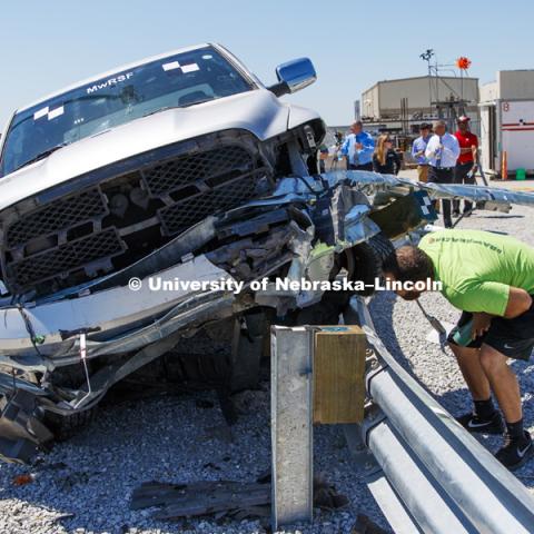 The results of the test were inspected by all. Test of bull-nose barrier for use in medians to protect cars from overpass columns. Test was at university's Midwest Roadside Safety Facility at the Lincoln airport. June 5, 2018. Photo by Craig Chandler / University Communication.