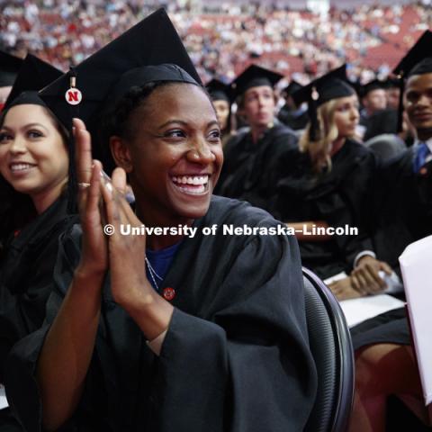 Kristen Dowell applauds her family and friends for their support in helping her reach her goal. Summer Commencement at Pinnacle Bank Arena. August 11, 2018. Photo by Craig Chandler / University Communication.