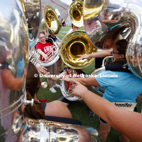 The sousaphone section comes together at the end of practice. Cornhusker Marching Band practice. August 13, 2018. Photo by Craig Chandler / University Communication.